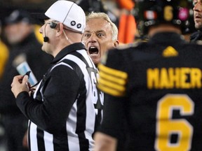 Hamilton Tiger-Cats special teams co-ordinator, Jeff Reinebold, yells at a referee following an attempted on-side kick by the Hamilton Tiger-Cats late in the second-half of CFL football action against the Edmonton Eskimos in Hamilton on October 28, 2016.&ampnbsp;Reinebold is back with the Tiger-Cats.The veteran CFL coach was named Hamilton's special-teams co-ordinator and assistant defensive backs coach Thursday.&ampnbsp;THE CANADIAN PRESS/Peter Power