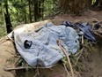 A bra is seen on top of a blanket near a gully where Amanda Dorrough was found