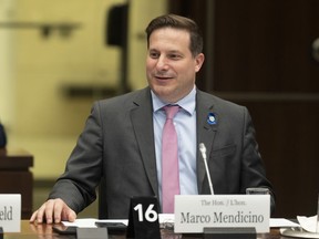 Public Safety Minister Marco Mendicino waits to appear at the Standing Committee on Justice and Human Rights, in Ottawa, April 17, 2023. After several days of behind-the-scenes negotiations, the Liberal government is set to outline a renewed attempt at enshrining a definition of banned assault-style firearms in legislation.