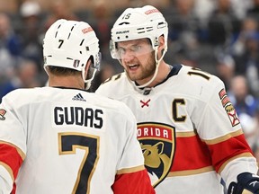 May 2, 2023; Toronto, Ontario, CANADA;   Florida Panthers forward Aleksander Barkov speaks with defenseman Radko Gudas in the third period against the Toronto Maple Leafs in game one of the second round of the 2023 Stanley Cup Playoffs at Scotiabank Arena.