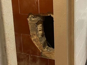 Hole in jail's cell block dug out by inmate.