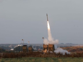 Israeli forces fire rockets from their Iron Dome defence system near the southern city of Sderot to intercept rockets launched from the Gaza Strip, on May 13, 2023.