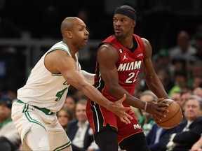 Jimmy Butler, right, of the Miami Heat is defended by Al Horford of the Boston Celtics during the second quarter of game one of the Eastern Conference Finals at TD Garden on May 17, 2023 in Boston.