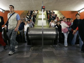 Commuters use an escalator Oct. 9, 2007 inside Hidalgo subway station in Mexico City.