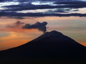 A plume of ash and steam rises from the Popocatepetl volcano, as seen from Mexico City, Wednesday, June 19, 2019.