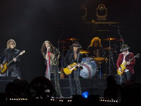 Tom Hamilton, from left, Steven Tyler, Joe Perry, John Douglas and Brad Whitford of Aerosmith, perform on Sept. 8, 2022, at Fenway Park in Boston.