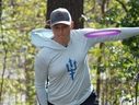 Natalie Ryan, transgender woman banned from playing a women's disc golf event in California, throws disc.