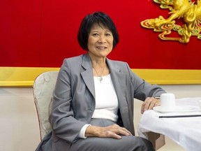 Olivia Chow sits at a table