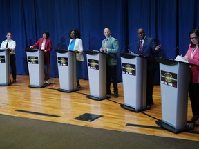 Toronto mayoral candidates Josh Matlow, left to right, Olivia Chow, Mitzi Hunter, Brad Bradford, Mark Saunders and Ana Bailao take the stage at a mayoral debate in Scarborough, Ont. on Wednesday, May 24, 2023.THE CANADIAN PRESS/Chris Young