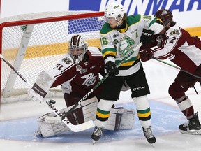London Knights forward Sean McGurn deflects the puck past Peterborough Petes goalie Michael Simpson during the first period of Game 3 of the OHL finals on Monday May 15, 2023 at the Memorial Centre in Peterborough. Clifford Skarstedt/Peterborough Examiner