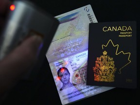 The new Canadian passport is unveiled at an event at the Ottawa International Airport in Ottawa on Wednesday, May 10, 2023. Passport controversy just the latest battle in the culture war over Canadian identity.