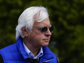 Bob Baffert walks near the stables ahead of the 148th running of the Preakness Stakes at Pimlico Race Course, Friday, May 19, 2023, in Baltimore.