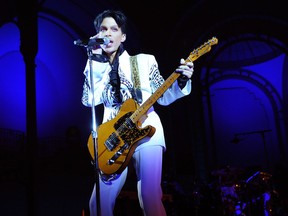 In this file photo taken on October 11, 2009 Prince performs at the Grand Palais in Paris.