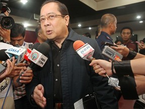 Philippine Interior Secretary Ronaldo Puno attends a news conference