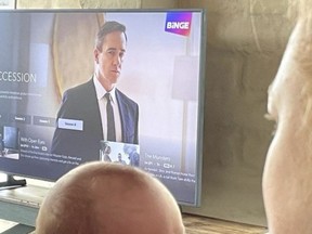 Sarah Snook shared this image showing the top of the head of her newborn in front of a television