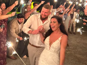 Aric Hutchinson and Samantha “Sam" Hutchinson are pictured at their wedding in a photo posted to a GoFundMe page created by his mother.