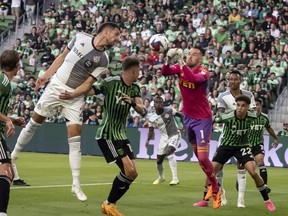 Austin FC goalkeeper Brad Stuver makes a save