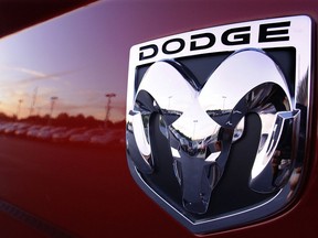 The Dodge logo is seen on a new Dodge RAM 3500 Heavy Duty pickup trucks at sunset at a dealership in Springfield, Ill., Aug. 15, 2010.