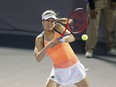 Canada's Eugenie Bouchard hits a return.