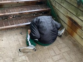 A woman rests in an awkward position.