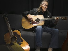 Gordon Lightfoot in dressing room before a show in Oshawa tunes his guitars to perfection --- Veronica Henri photo