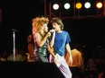 Tina Turner and Mick Jagger are pictured in during their performance at Live Aid