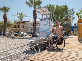At each site, a wheelchair-friendly wooden walkway leads to a chair set on a single track. Users transfer themselves into the recliner and "drive" into the water.