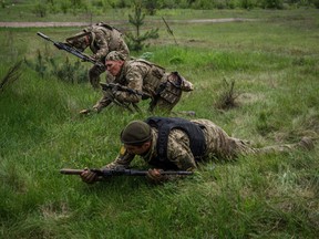 Ukrainian servicemen take part in a military exercise in the Kharkiv region on May 1, 2023.