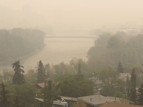 Heavy smoke from northern Alberta forest fires comes south to blanket the Bow River area in downtown Calgary, Tuesday May 16, 2023. Air quality statements continue to blanket much of British Columbia and the Prairie provinces as scores of wildfires rage.