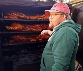 Picnic co-owner Wyatt Dickson shows off his smokers — and the hogs being cooked — in Durham, N.C. (Dave Pollard/Toronto Sun)