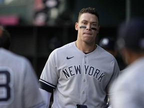New York Yankees' Aaron Judge walks through the dugout during the first inning of the team's baseball game against the Texas Rangers, Thursday, April 27, 2023, in Arlington, Texas.
