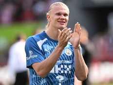 Erling Haaland applauds fans.