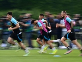 Inter Milan players run during training.