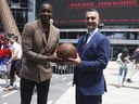 Toronto Raptors president Masai Ujiri poses with new head coach Darko Rajakovic outside ScotiaBank Arena.