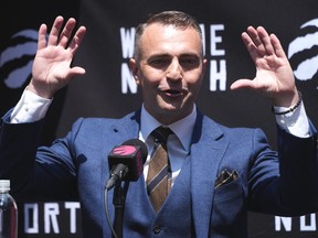 Darko Rajakovic gestures at a news conference.