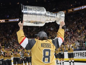 Phil Kessel skates with the Stanley Cup.