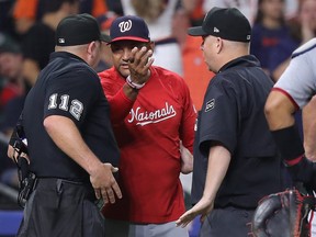 Dave Martinez argues with umpires.