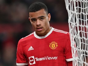 Manchester United's Mason Greenwood is substituted during a game.