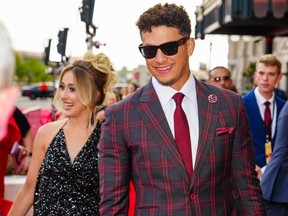 Chiefs quarterback Patrick Mahomes and his wife Brittany walking the red carpet.