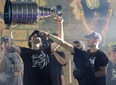 Chandler Stephenson gives Mark Stone a drink as he hoists the Stanley Cup.