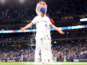 Chris Bassitt of the Toronto Blue Jays is doused with water.