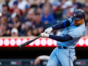 Blue Jays' Kevin Kiermaier hits a triple against the Minnesota Twins in the fifth inning at Target Field on May 26, 2023 in Minneapolis.