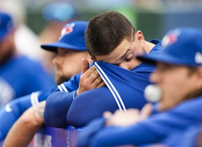 Alek Manoah of the Blue Jays wipes his brow in the dugout after getting pulled in the first inning against the Houston Astros on June 5, 2023 in Toronto. MARK BLINCH/GETTY IMAGES