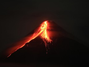 Mount Mayon spews lava during an eruption
