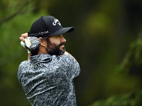 Adam Hadwin of Canada hits a shot.