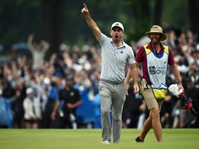 Nick Taylor of Canada celebrates after making a putt.