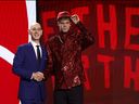 Gradey Dick, right, is announced as the Toronto Raptors' pick at 13th overall alongside NBA commissioner Adam Silver during the first round of the 2023 NBA Draft at Barclays Center in Brooklyn, N.Y., on Thursday, June 22, 2023.