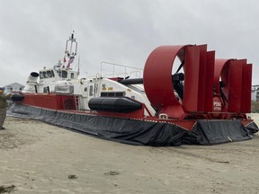 a retired Canadian Coast Guard hovercraft that was deliberately run aground because of a tear in its skirt, on Hampton Beach, N.H.