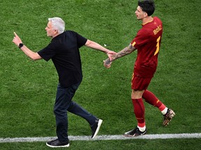 AS Roma's Portuguese coach Jose Mourinho (L) reacts to the injury of AS Roma's Brazilian defender Roger Ibanez during the UEFA Europa League final football match between Sevilla FC and AS Roma at the Puskas Arena in Budapest on May 31, 2023.