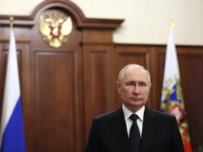 Russian President Vladimir Putin delivers a video address.